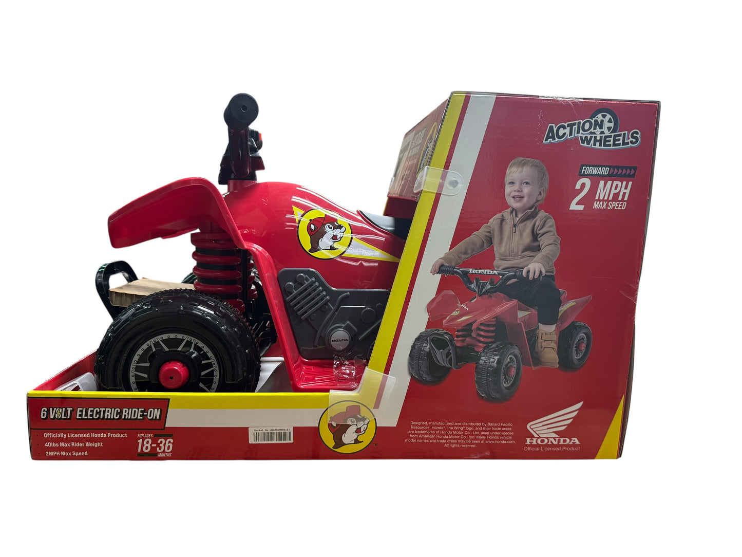 Red toy ATV with Honda branding on a white background